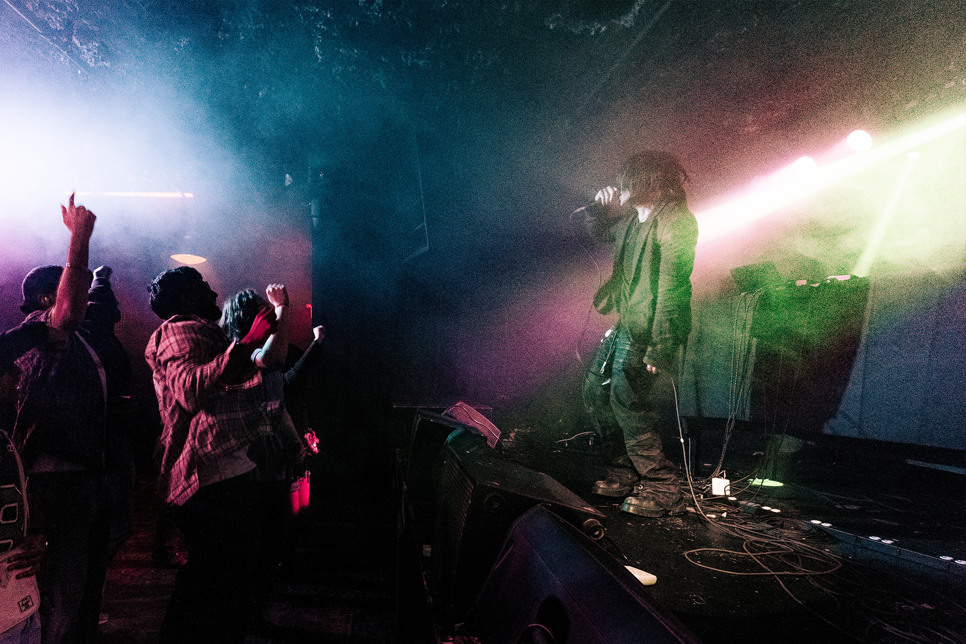 nomu live on stage, wide shot with haze